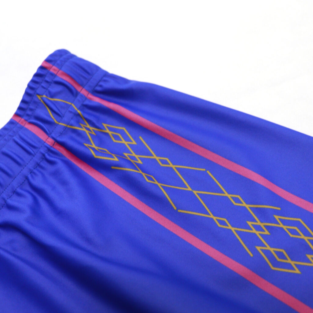 Geometric side panel print on blue volleyball shorts