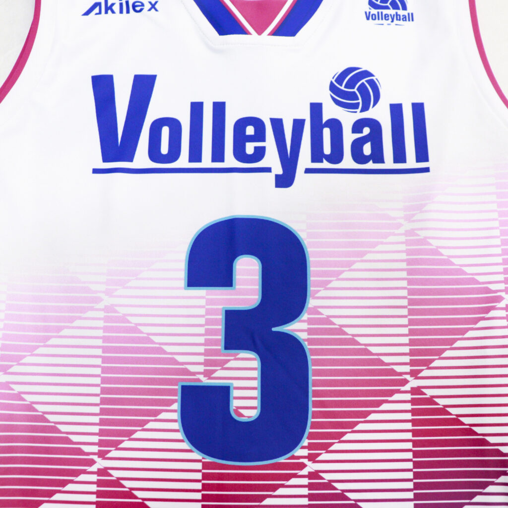 Front number print on white pink and blue volleyball jersey