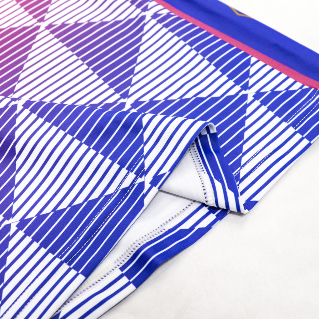 Hem and flatlock seam detail on sleeveless volleyball jersey