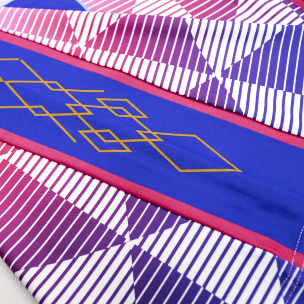 Pink and blue side panel graphic on sublimated volleyball jersey