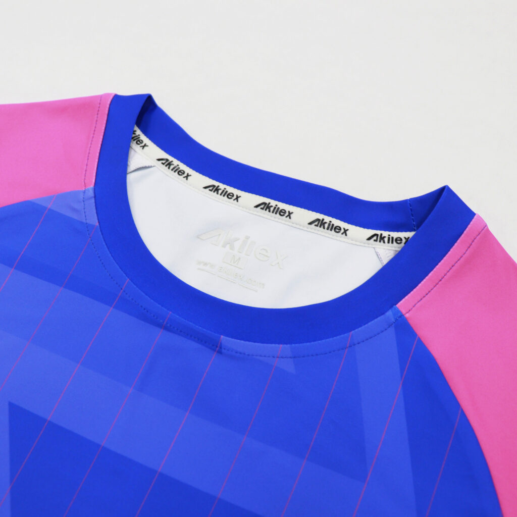 Round neck detail on blue and pink long sleeve volleyball jersey