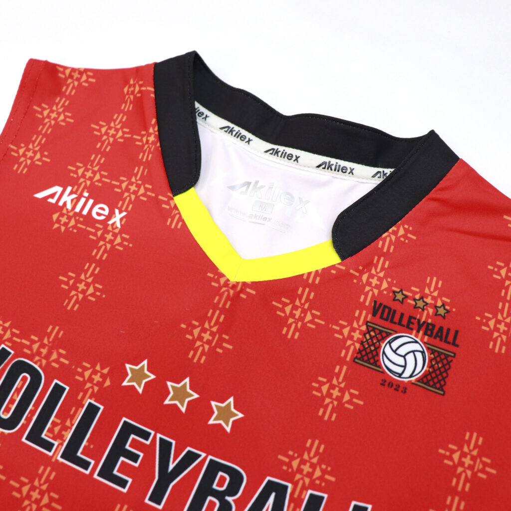 V-neck collar and chest logo detail on orange volleyball jersey