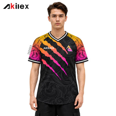 Model facing forward in a black shirt with yellow and pink jagged stripes, swirling patterns and chest markings.