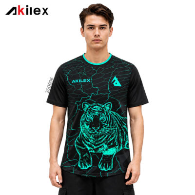 Model facing forward in a black shirt with a turquoise tiger graphic, cracked lines and chest markings.