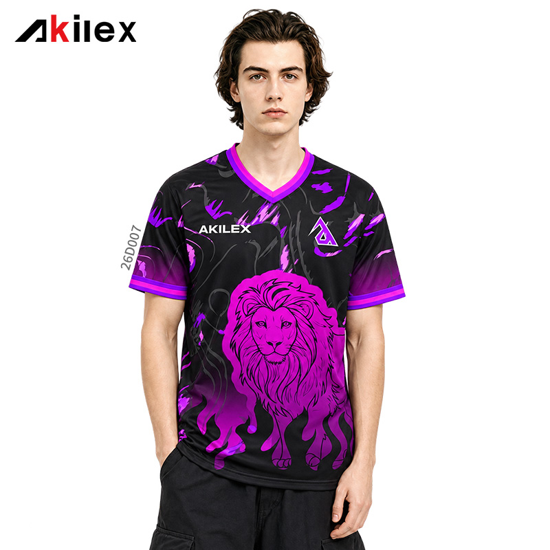 Model facing forward in a black V-neck shirt with a purple lion graphic, lettering and purple trim.