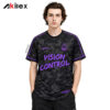 Model facing forward in a black and gray camouflage shirt with purple lettering, emblems and trim.