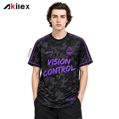 26D008m模特图1 Model facing forward in a black and gray camouflage shirt with purple lettering, emblems and trim.